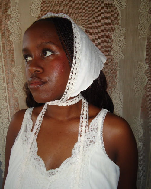 girl wearing white headscarf with lace details